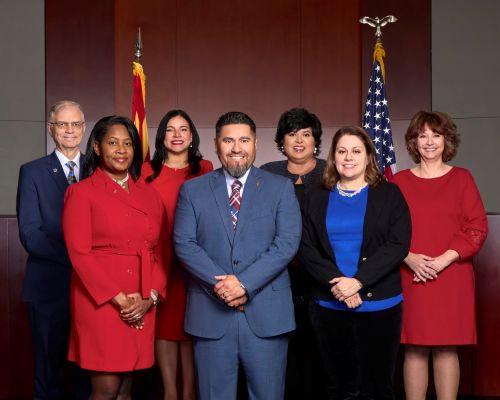 Avondale City Council standing in front of the Council Chamber